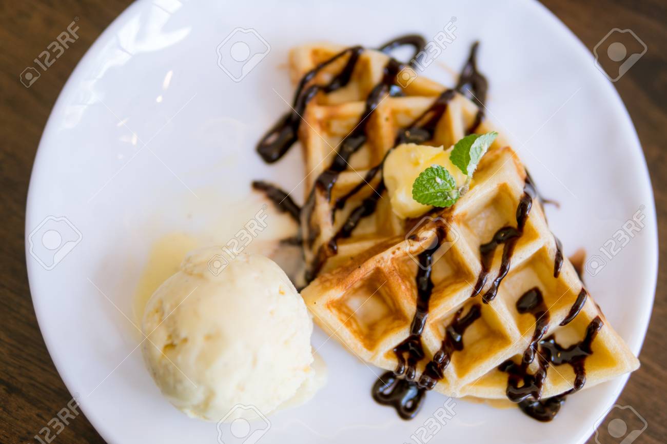 Waffles with ice cream with chocolate and mint leaf - 97483063 Waffles with ice cream with chocolate and mint leaf - 97483063
