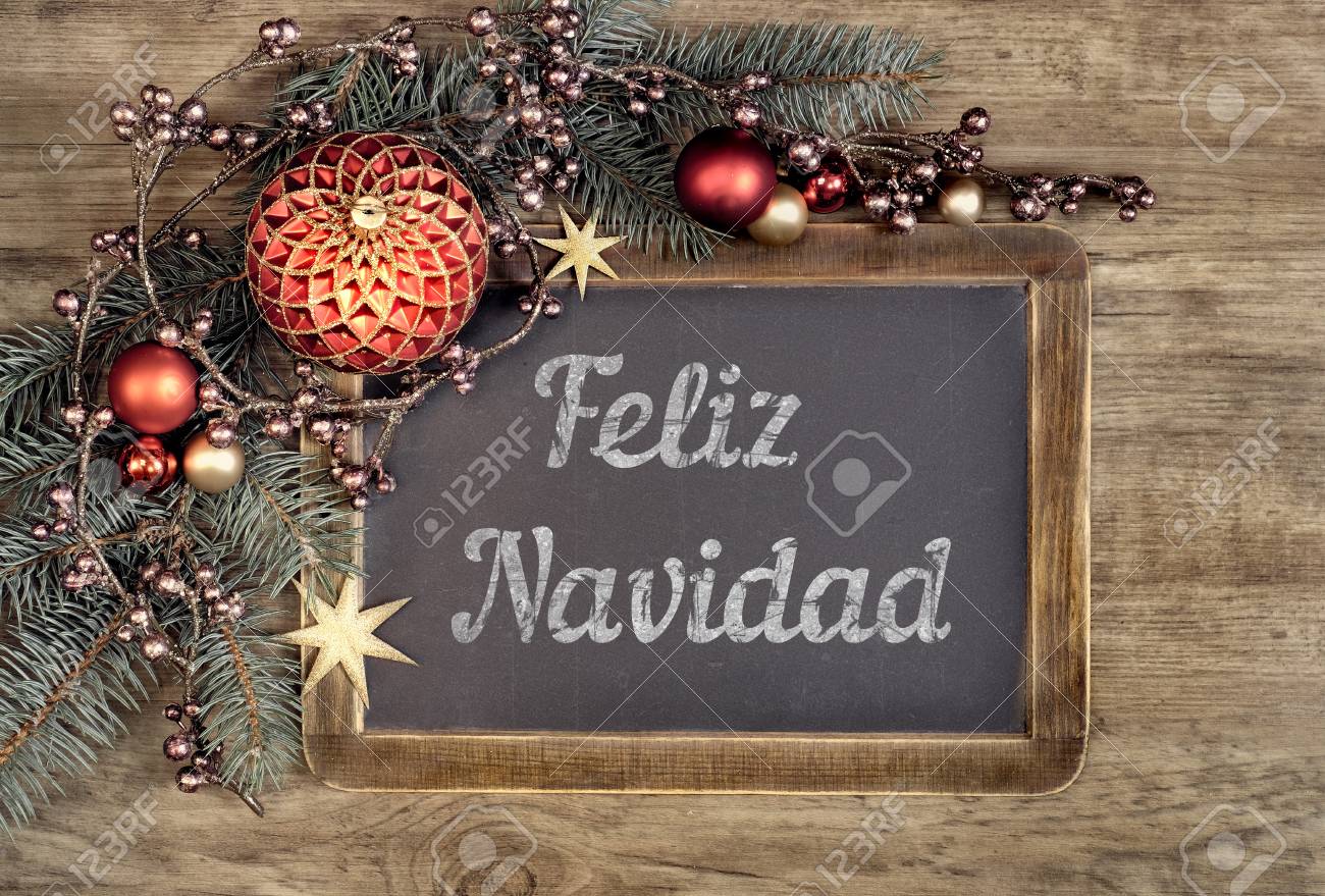Decorated Blackboard With Text Feliz Navidad Or Merry Christmas Stock Photo Decorated Blackboard With Text Feliz Navidad Or Merry Christmas In Spanish On Oak Wood Background
