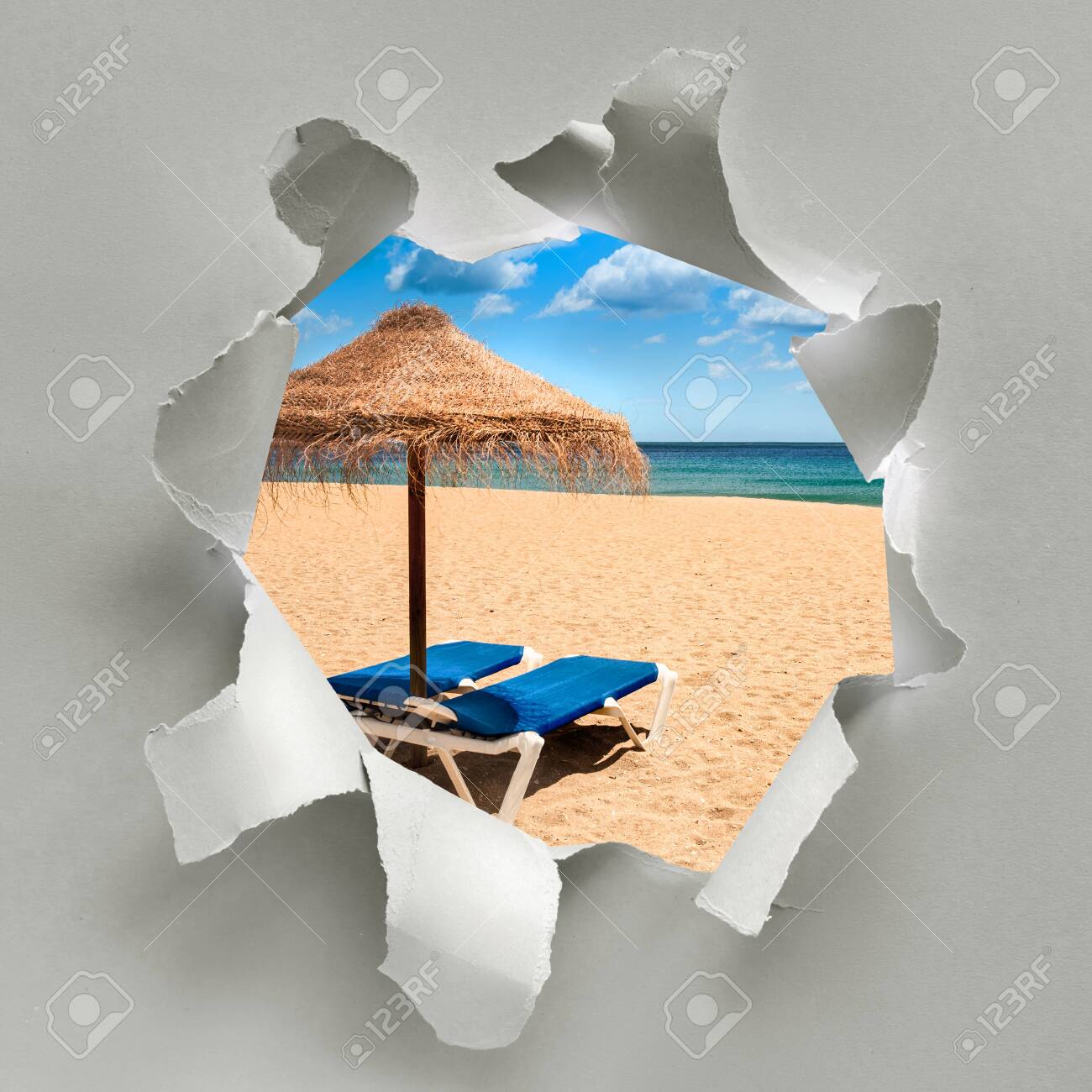 Paper Hole With Image Of Deserted Beach With Palm Sunshade And Stock Photo Picture And Royalty Free Image Image 141630000