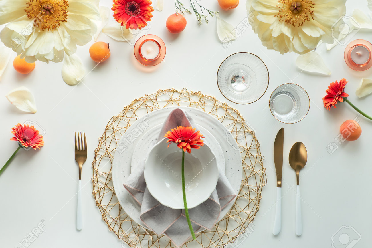 Effortless Golden Birthday Dinner Table Decor. Summer Flat Lay. White Dinner Table, White And Gold Utensils, Decorated With Peony Flowers, Orange Gerberas And Tasty Apricots. Stock Photo, Picture And Royalty Free Image. Effortless Golden Birthday Dinner Table Decor. Summer Flat Lay. White Dinner Table, White And Gold Utensils, Decorated With Peony Flowers, Orange Gerberas And Tasty Apricots. Stock Photo, Picture And Royalty Free Image.