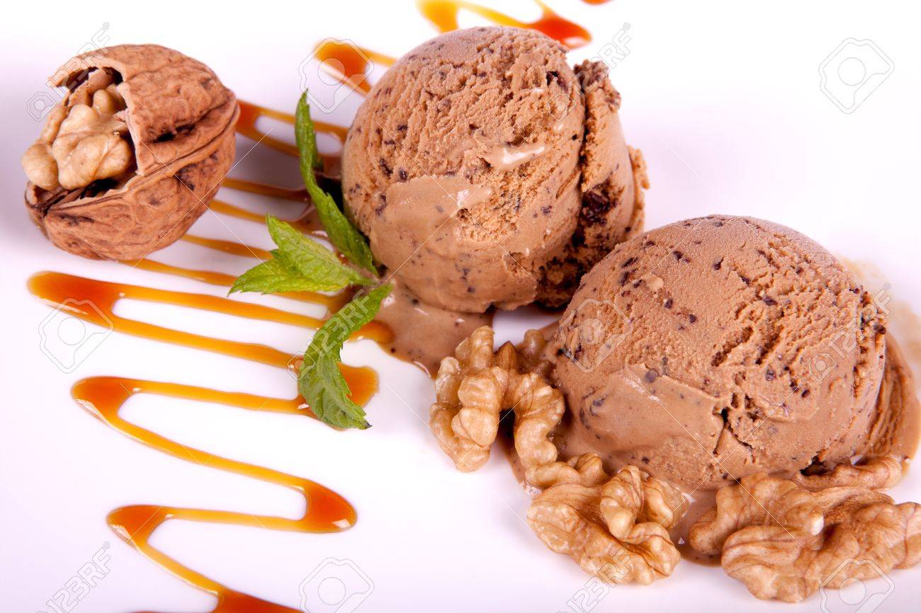 mocha ice cream dessert with caramel sauce and walnuts stock photo