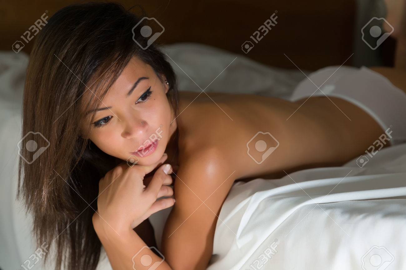 Young Asian Woman Naked In White Panties Lying On A Bed With Wrinkled  Sheets Stock Photo, Picture and Royalty Free Image. Image 48320375.