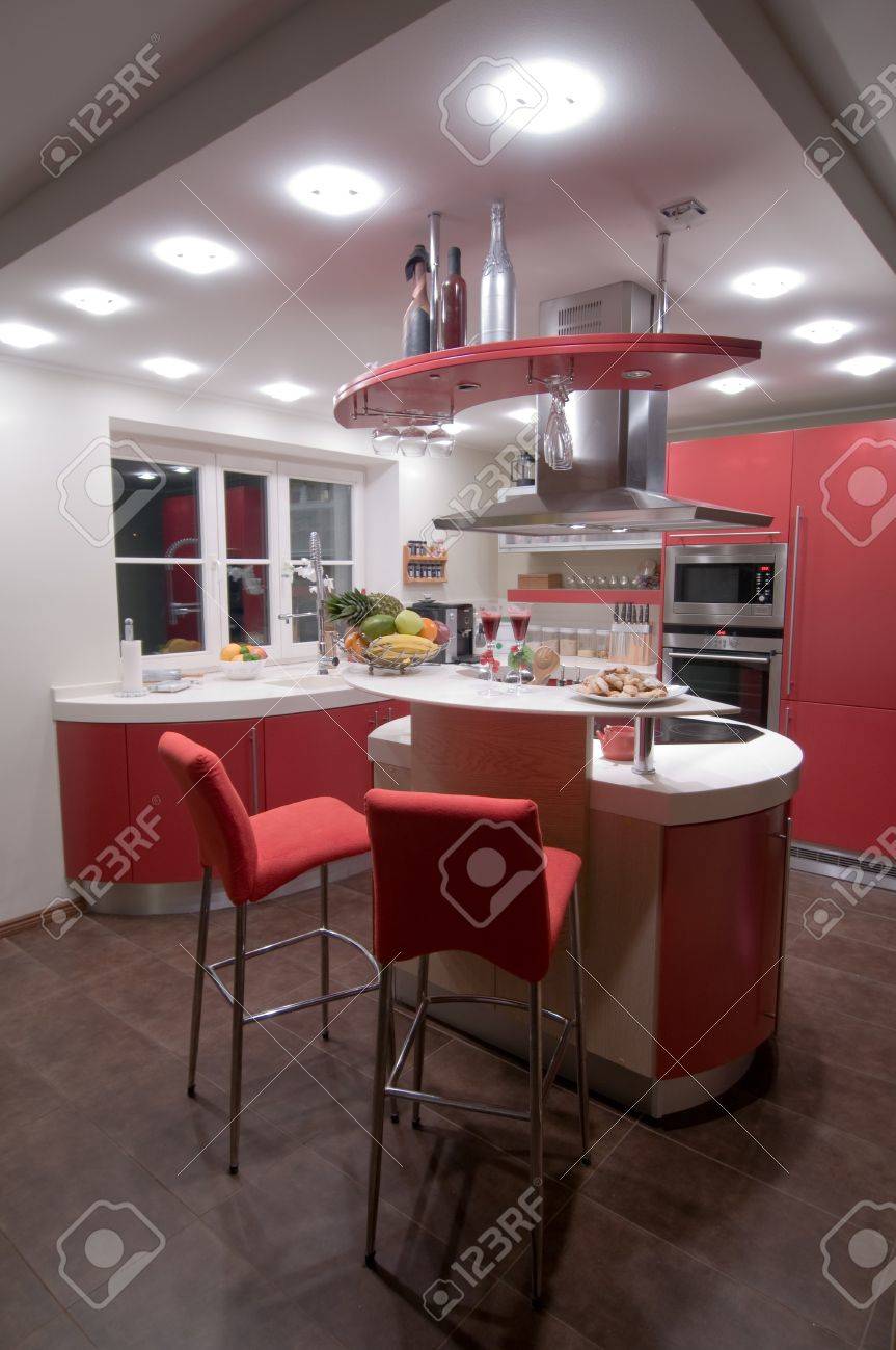Red modern kitchen. Interiors. Cupboard. Table top. - 4352106 Red modern kitchen. Interiors. Cupboard. Table top. - 4352106