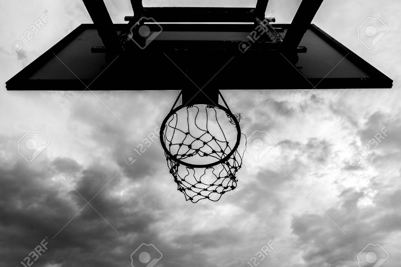 Black And White Of Old Basketball Hoop On Sky Background And