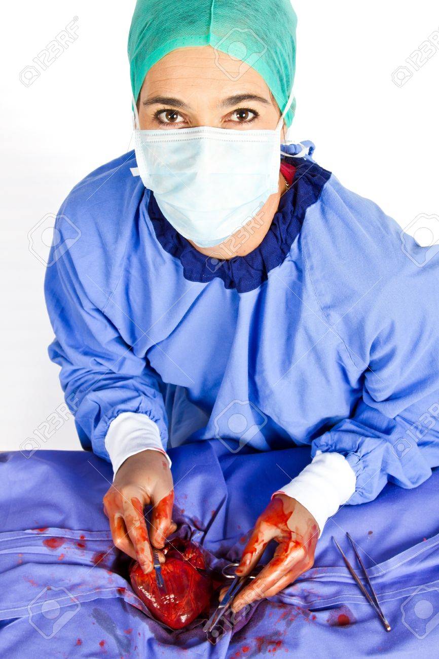 doctor operating on patient heart in blue with tools stock photo