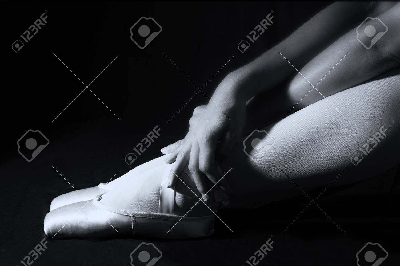 Ballerina Sit Down On Floor To Put On Slippers With Hands Prepare
