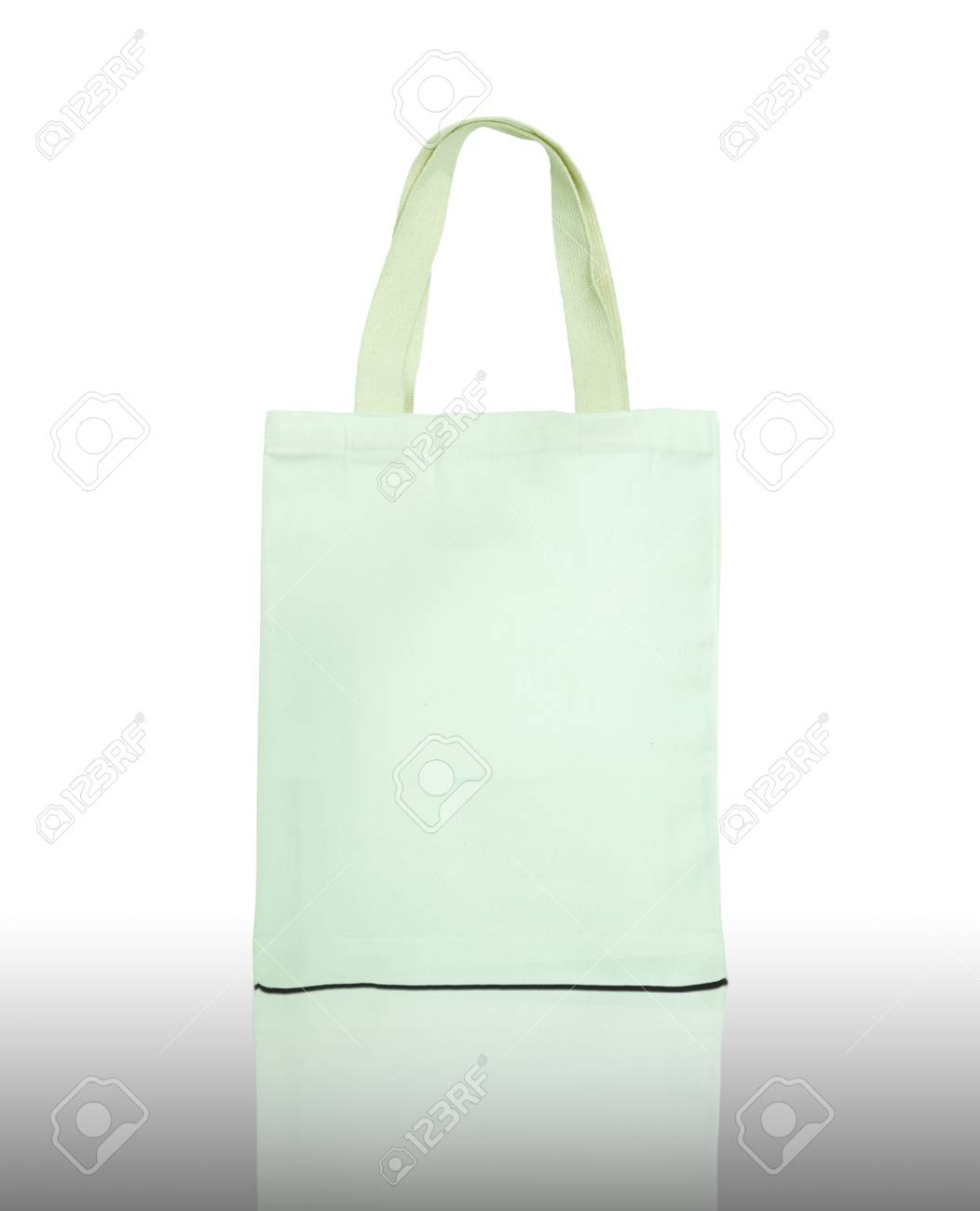 White Cotton Bag On Reflect Floor And White Background Stock Photo