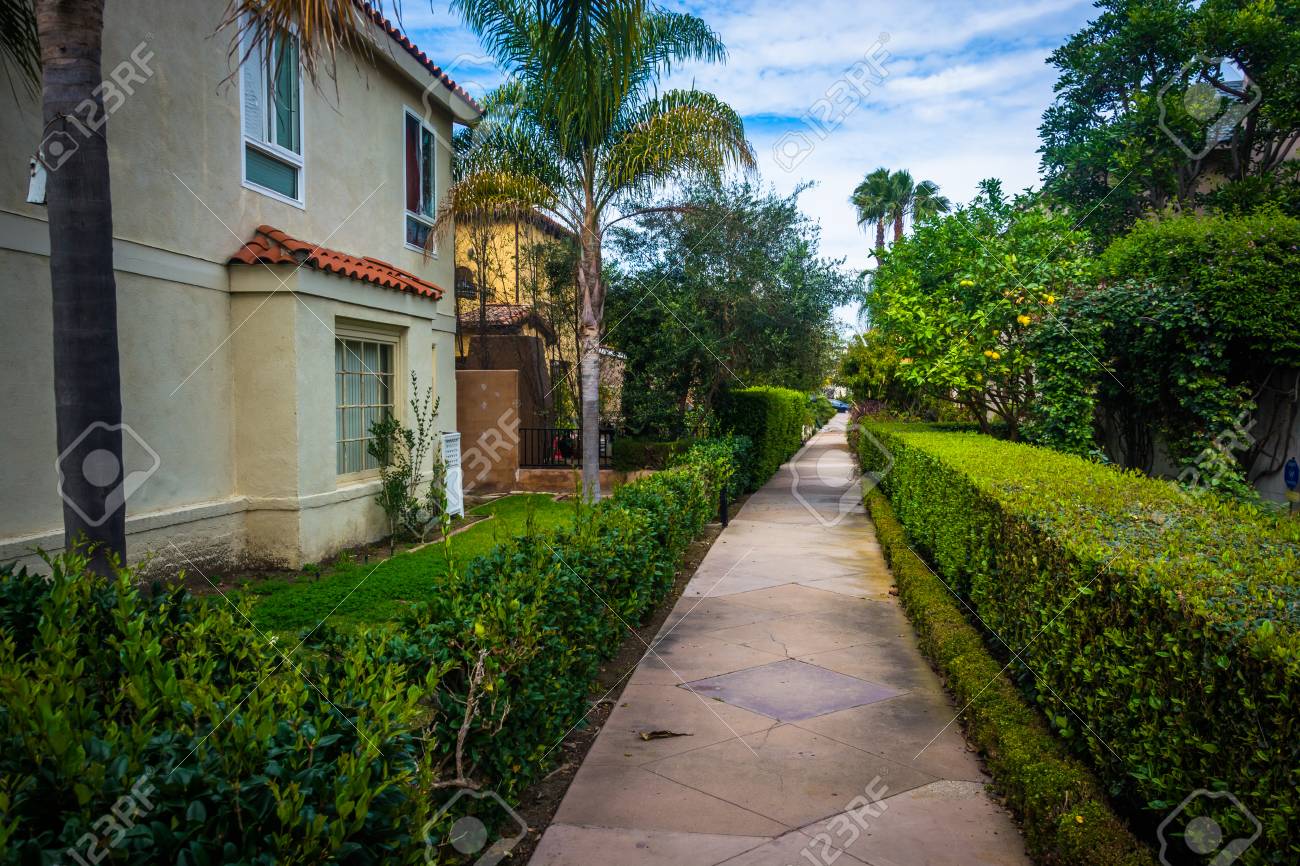 gardens and house along walkway on lido isle in newport beach