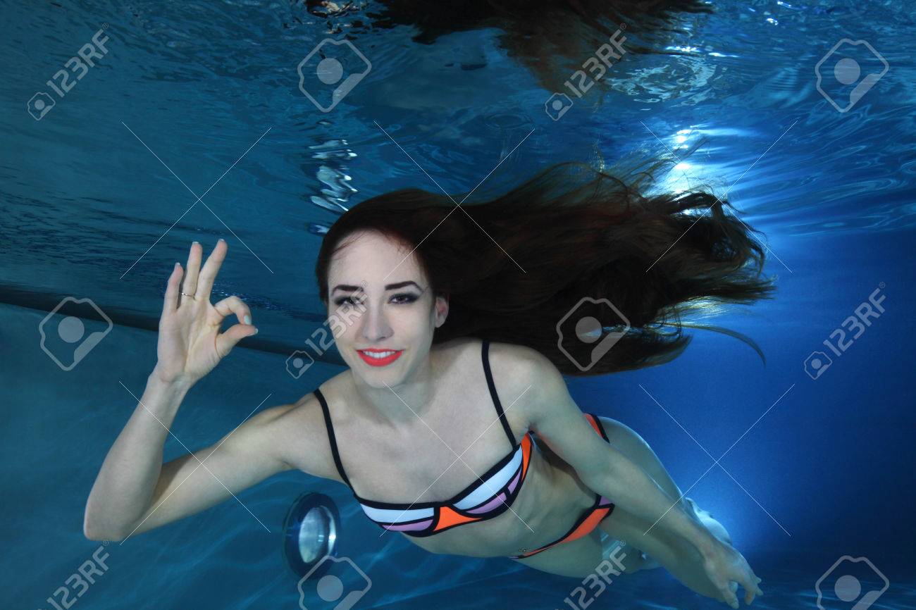 Woman Swimming Underwater Stock Photo, Picture and Royalty Free Image.  Image 56558273., image size:1300x866