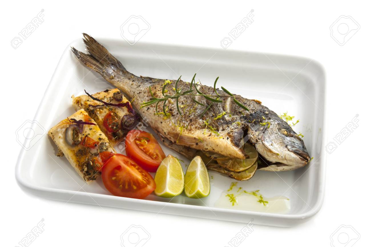 oven cooked fish dorade with bread an spices stock photo picture