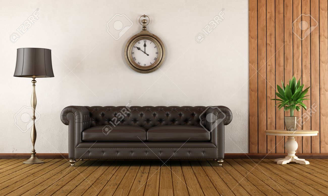 Vintage living room with classic sofa,wood paneling and white ...