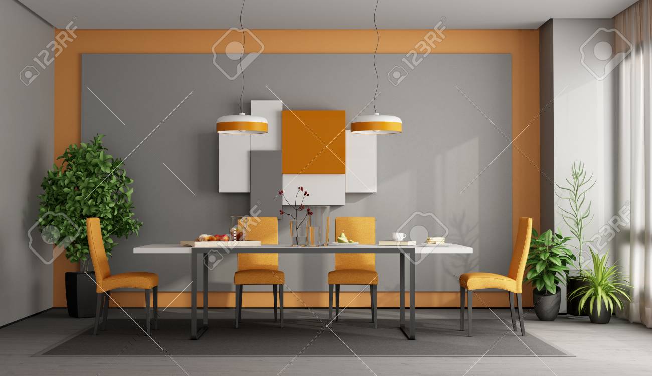 Gray And Orange Dining Room With Table And Chairs On Carpet Stock Photo
