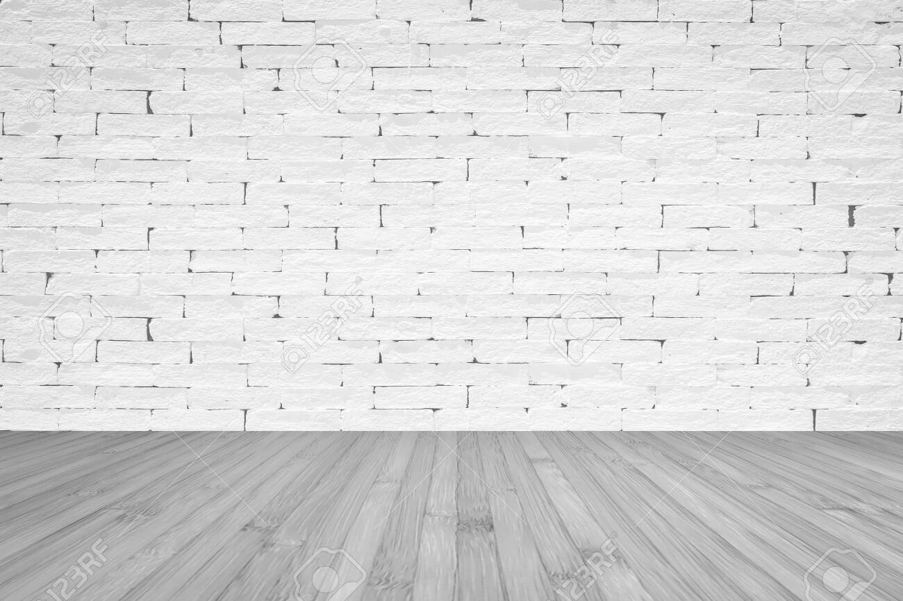 Grunge Old Aged Brick Wall Painted In White Color With Wooden