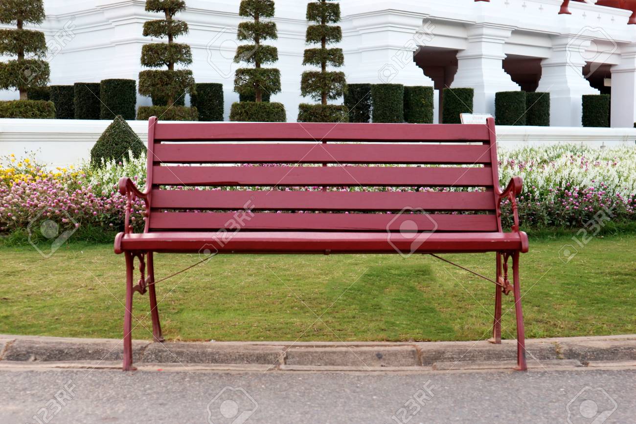red wooden bench in the park stock photo picture and royalty free