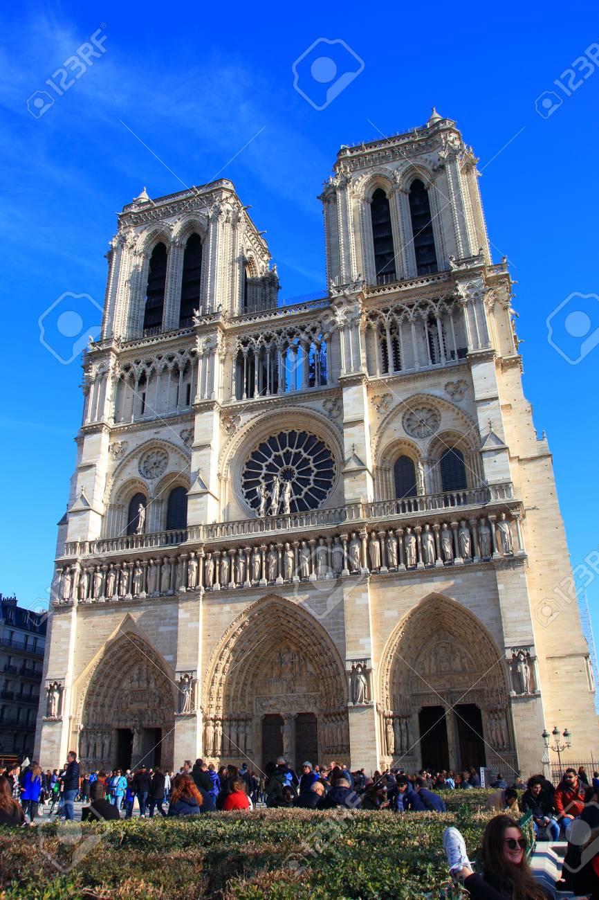 Notre Dame Cathedral in Paris and visiting tourists , France - 122540125 Notre Dame Cathedral in Paris and visiting tourists , France - 122540125