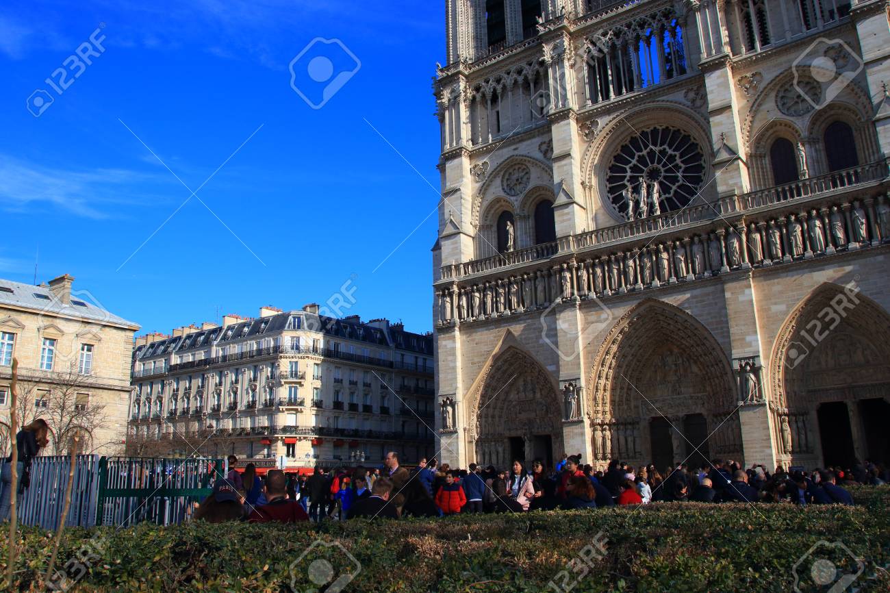 Notre Dame Cathedral in Paris and visiting tourists , France - 122540127 Notre Dame Cathedral in Paris and visiting tourists , France - 122540127