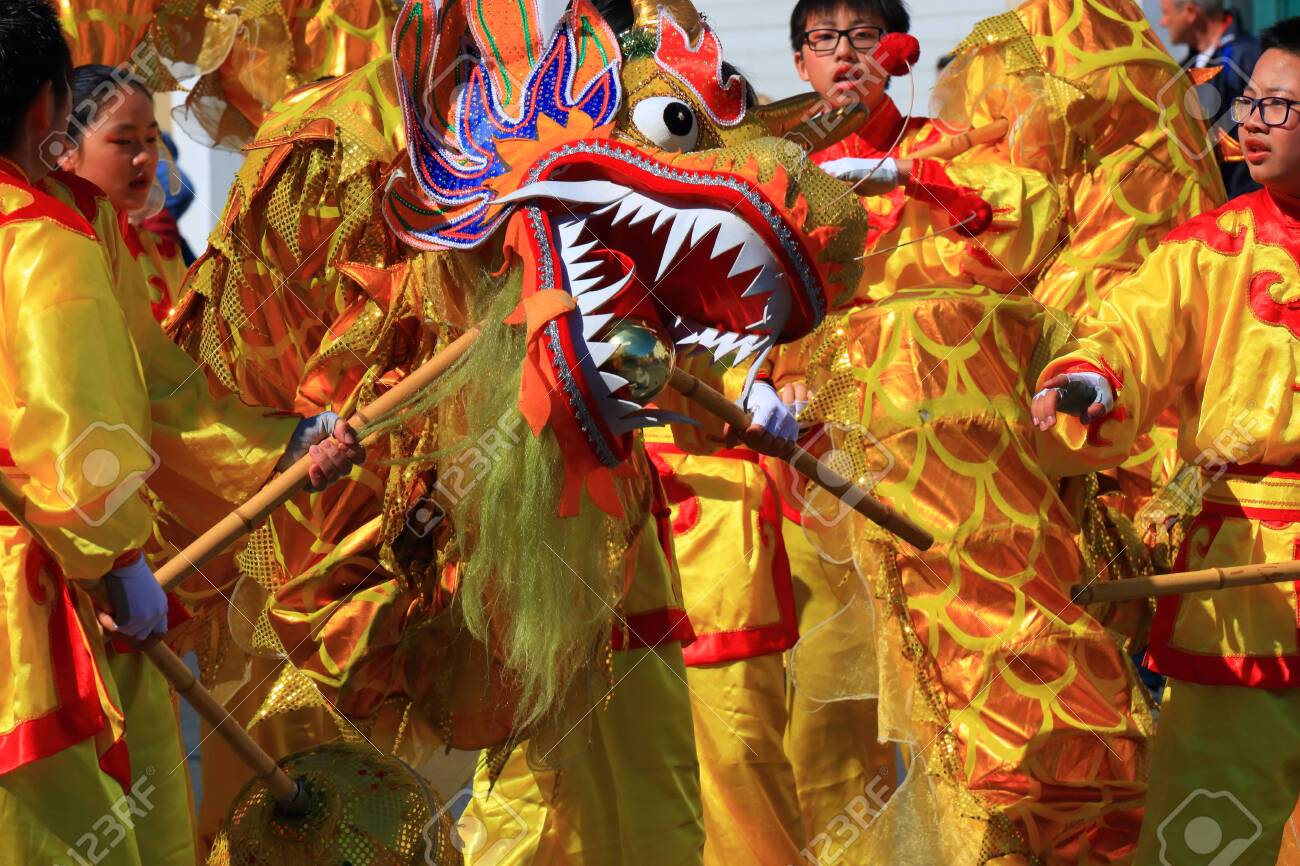 Asian parade with a dragon at the Limoux carnival in Aude, Occitanie in the south of France - 143985294 Asian parade with a dragon at the Limoux carnival in Aude, Occitanie in the south of France - 143985294