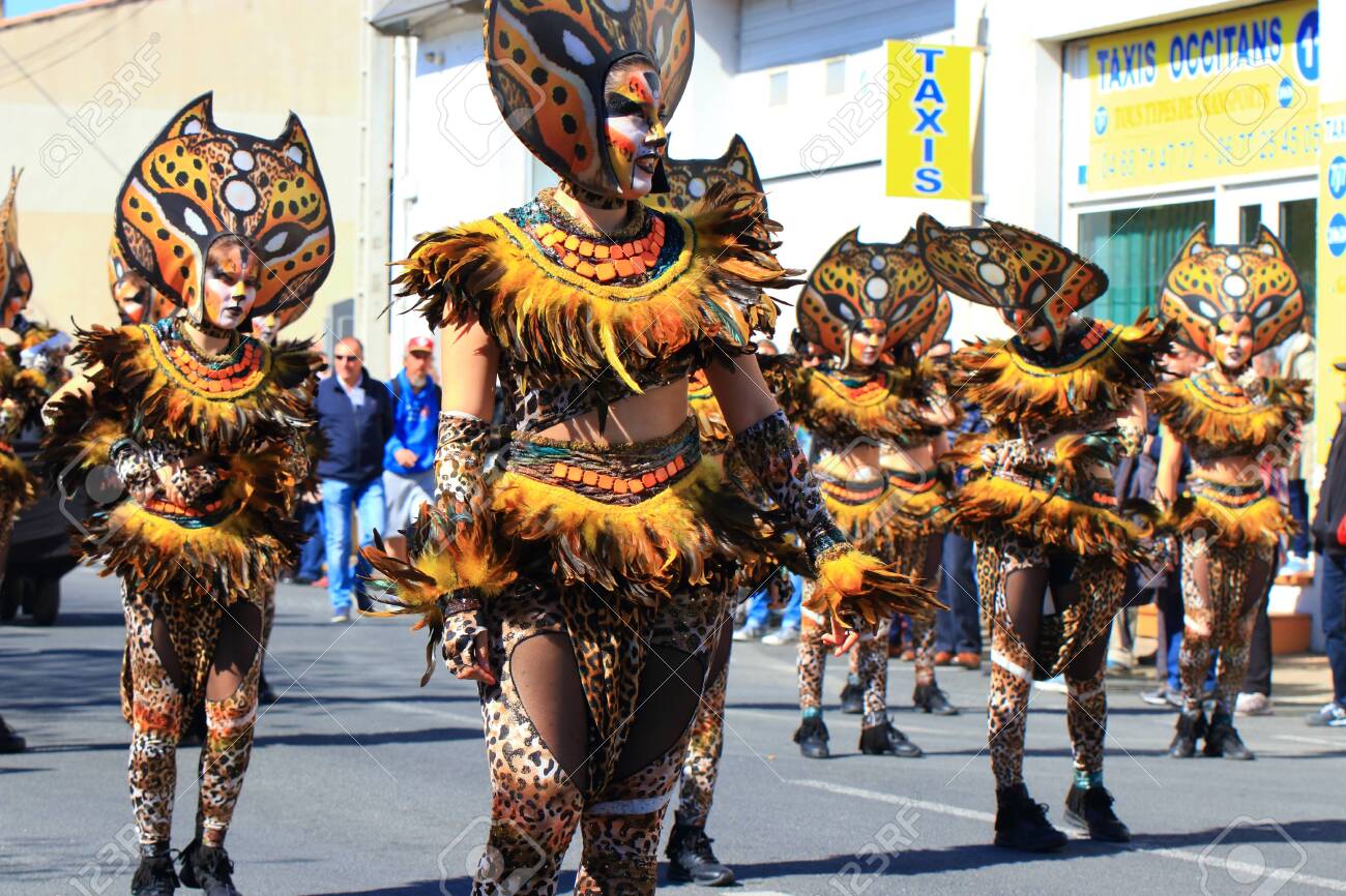 Disguised people parading at the Carnival of Limoux, Occitanie in the south of France - 143985308 Disguised people parading at the Carnival of Limoux, Occitanie in the south of France - 143985308