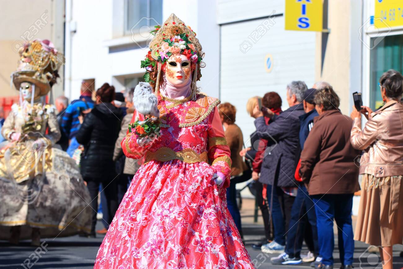woman with a Venetian mask at the carnival of Limoux in the Aude - 143985313 woman with a Venetian mask at the carnival of Limoux in the Aude - 143985313
