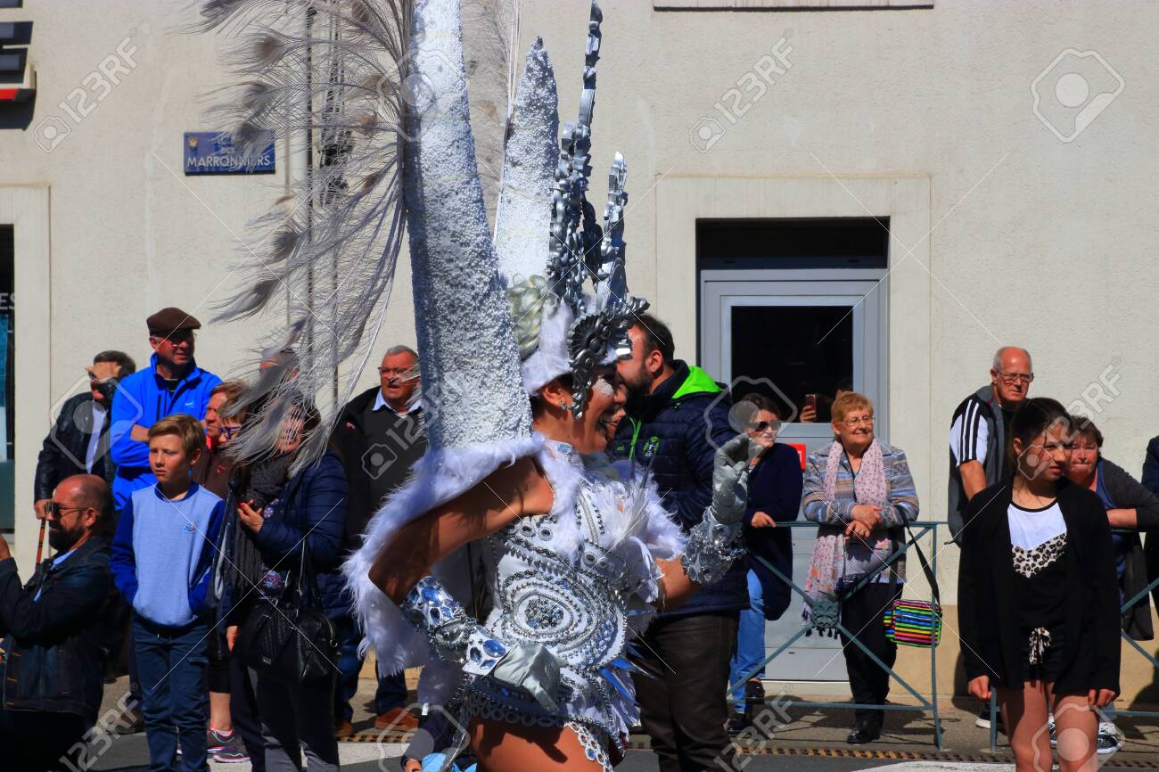 Angels parade at the french carnival of Limoux in Aude, Occitania in the southern of France - 143985481 Angels parade at the french carnival of Limoux in Aude, Occitania in the southern of France - 143985481