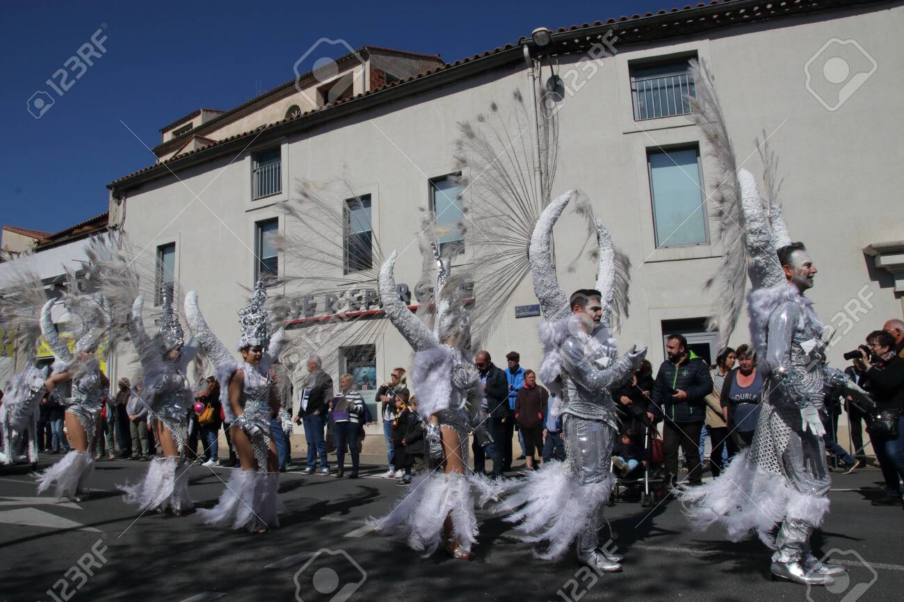 Angels parade at the french carnival of Limoux in Aude, Occitania in the southern of France - 143985484 Angels parade at the french carnival of Limoux in Aude, Occitania in the southern of France - 143985484