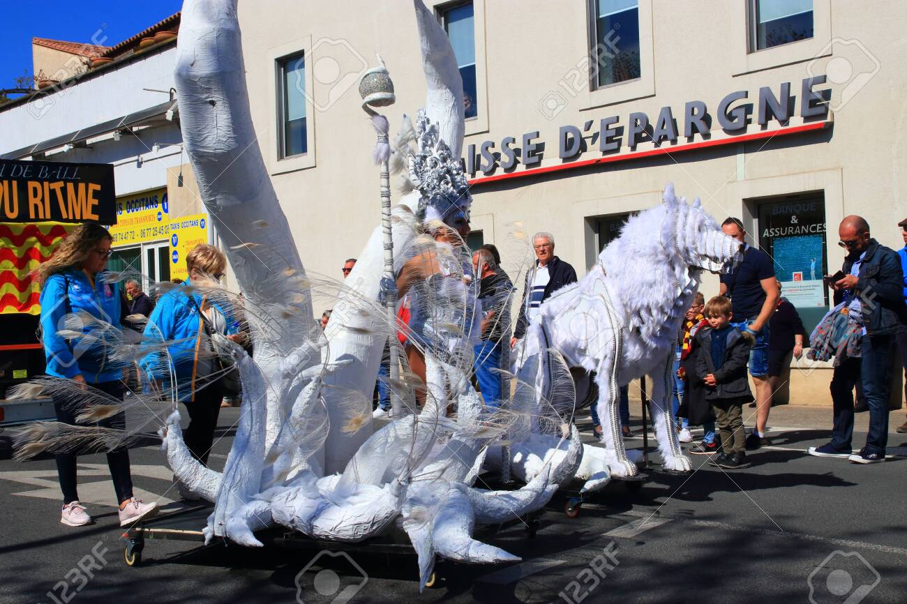 Angels parade at the french carnival of Limoux in Aude, Occitania in the southern of France - 143985485 Angels parade at the french carnival of Limoux in Aude, Occitania in the southern of France - 143985485