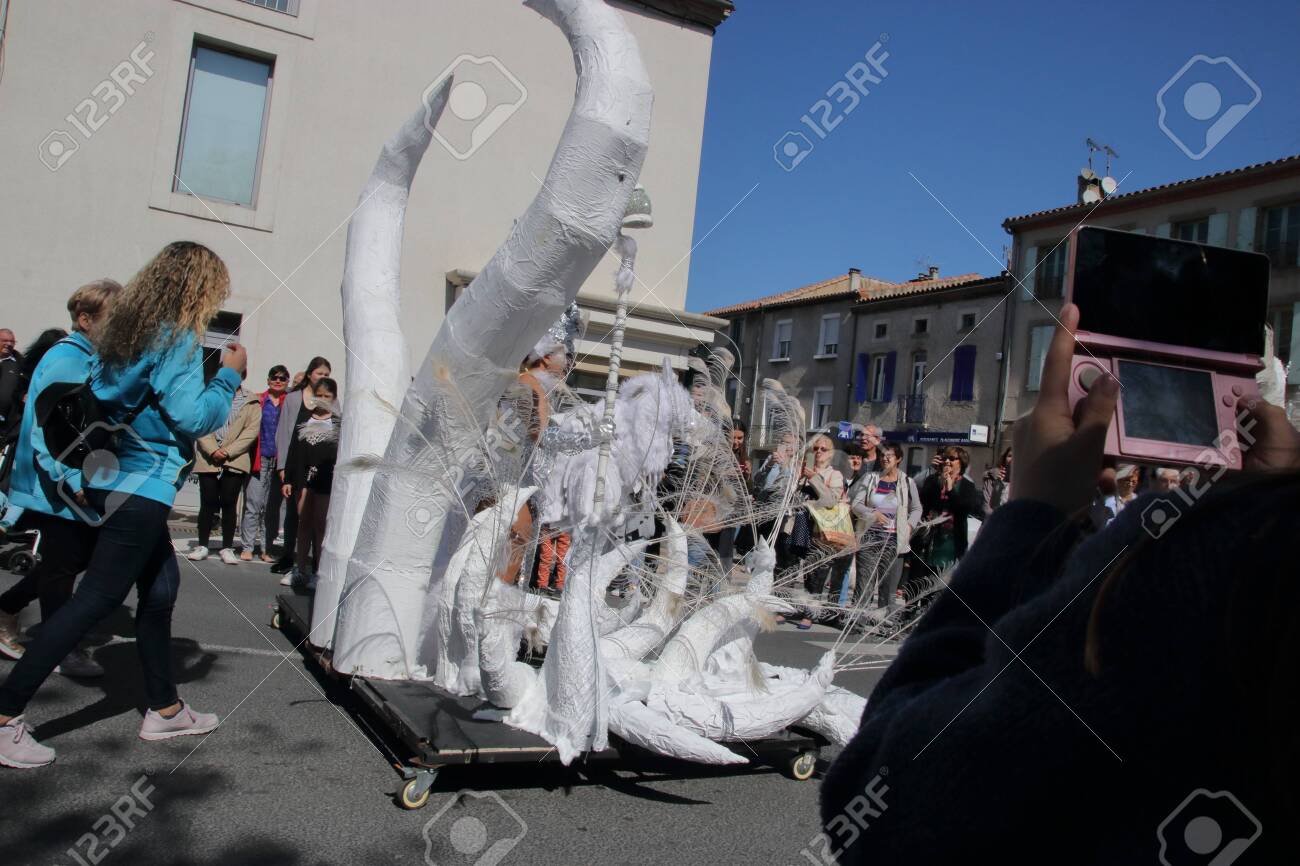Angels parade at the french carnival of Limoux in Aude, Occitania in the southern of France - 143985487 Angels parade at the french carnival of Limoux in Aude, Occitania in the southern of France - 143985487