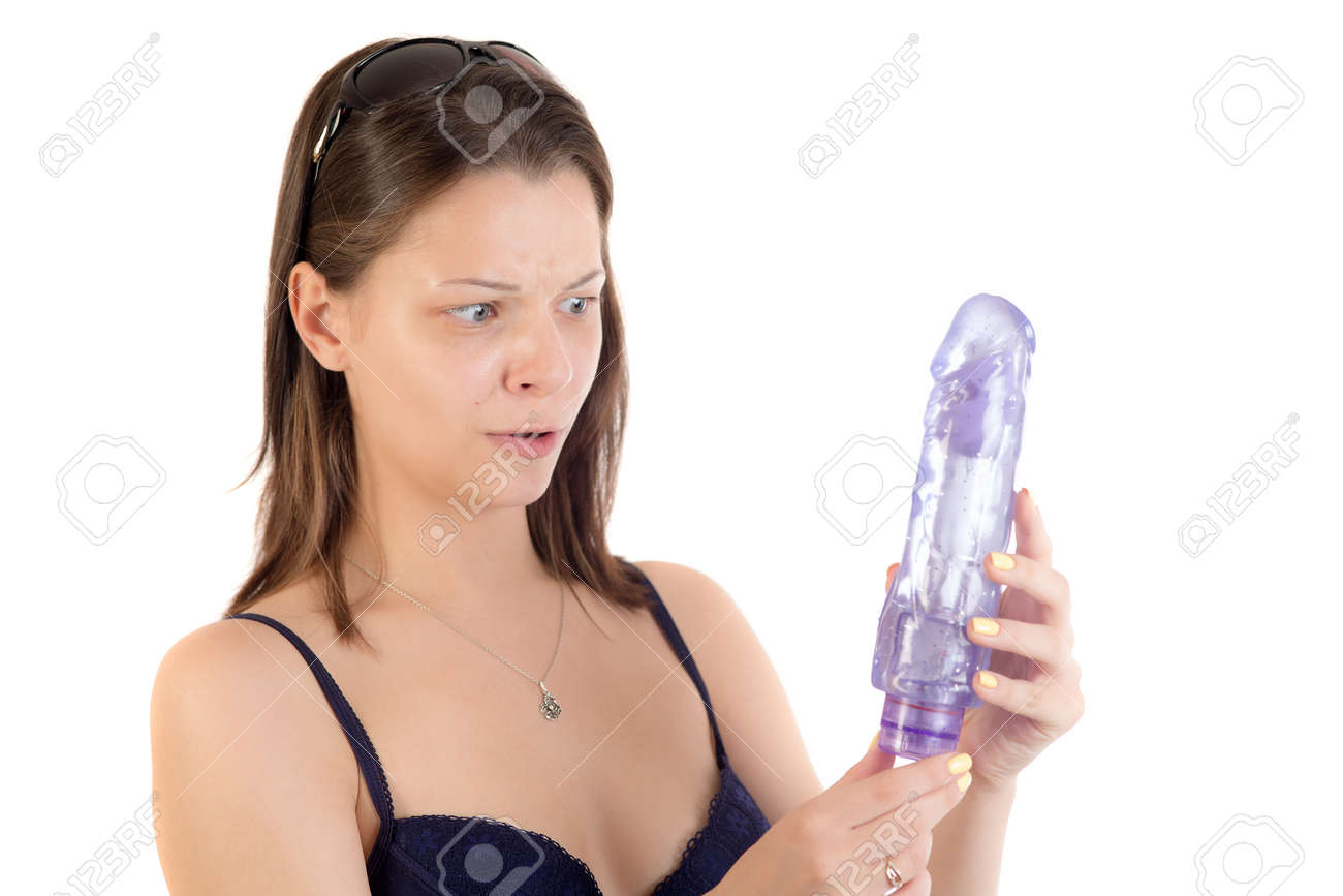 Woman Looks In Amazement At The Vibrator Stock Photo, Picture And Royalty Free Image. Image 61442922.