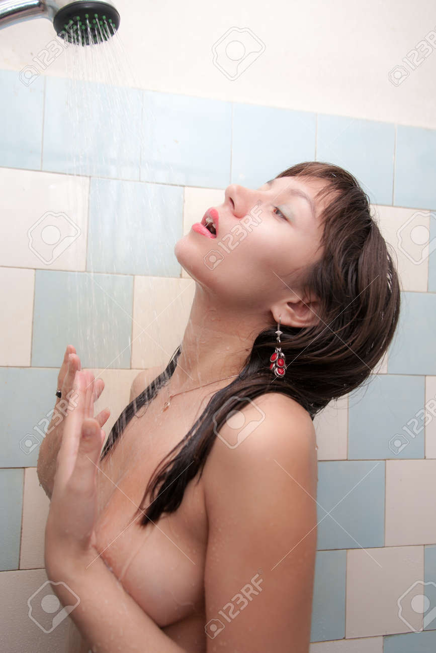 Beautiful Naked Girl Under The Streams Of The Shower Stock Photo, Picture  and Royalty Free Image. Image 91514061.