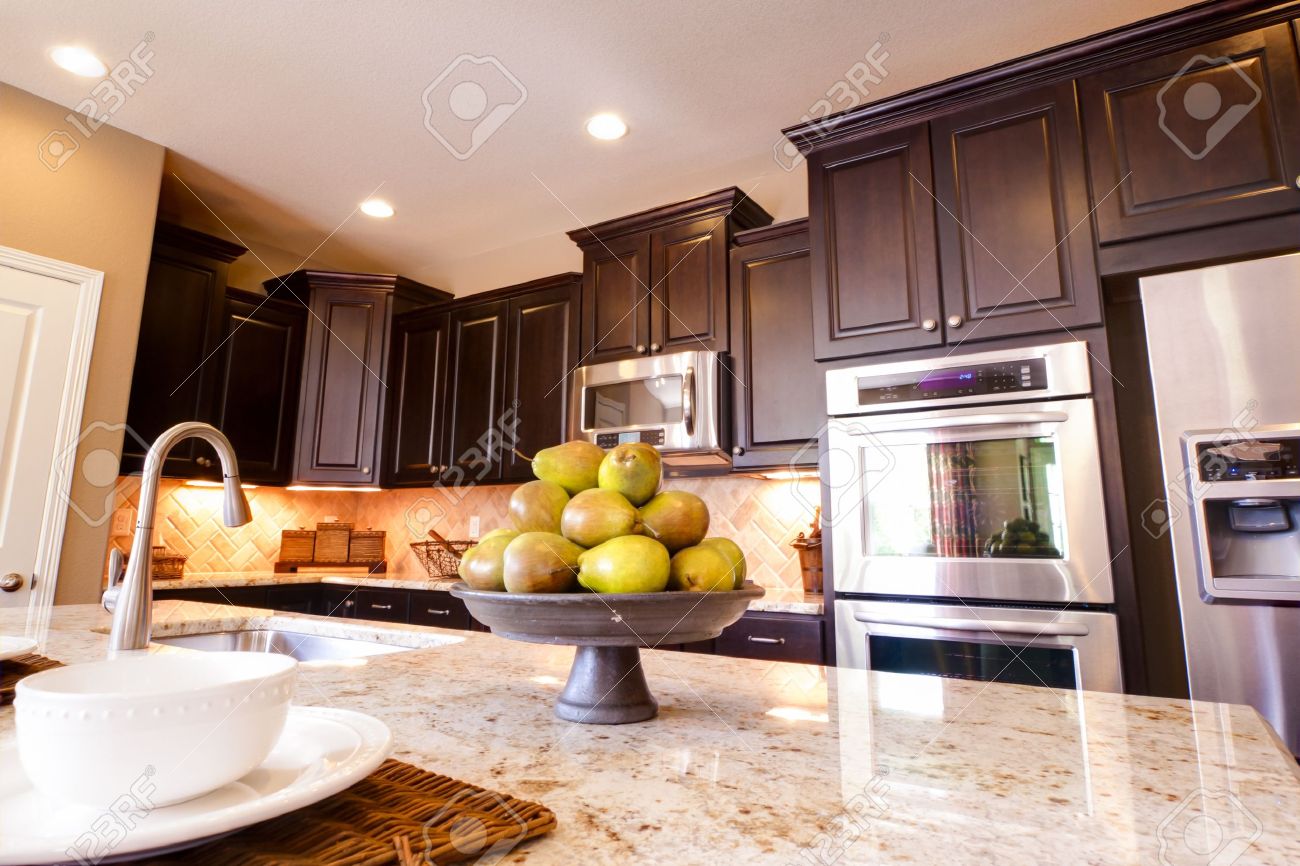 Modern Kitchen With Dark Wood Cabinets And Hardwood Floors Stock Modern Kitchen With Dark Wood Cabinets And Hardwood Floors Stock