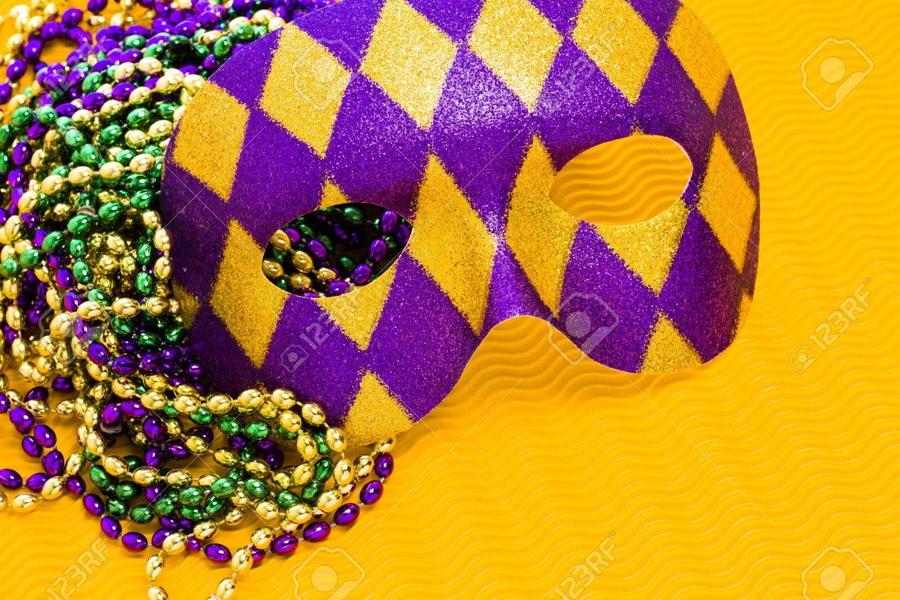 Download Mardi Gras Beads And Mask On Yellow Backgound Stock Photo Picture And Royalty Free Image Image 17874267 PSD Mockup Templates