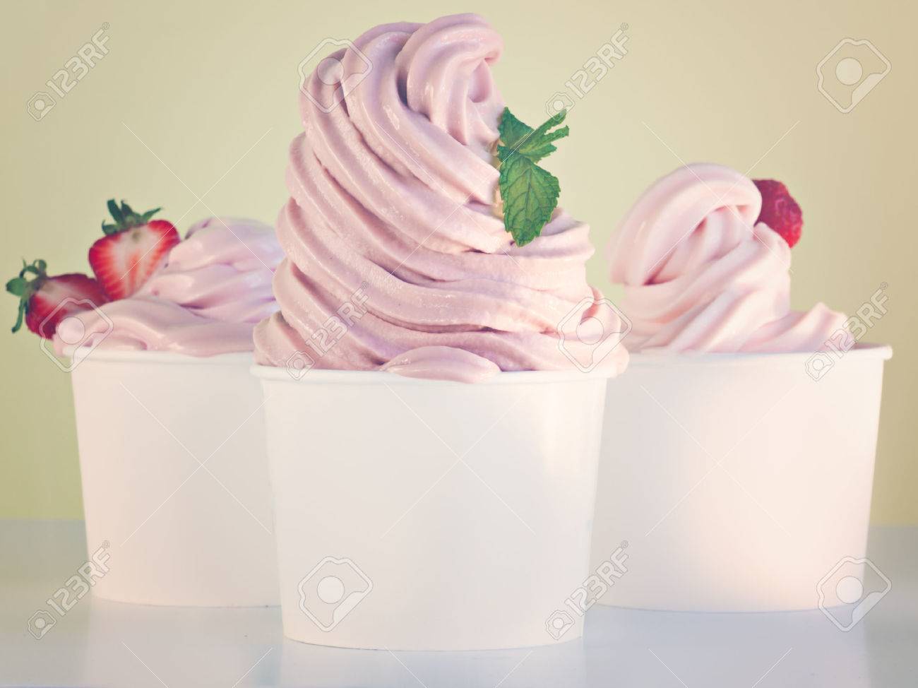 Cup of strawberry frozen yogurt or soft serve ice cream with fresh fruit. - 48039557 Cup of strawberry frozen yogurt or soft serve ice cream with fresh fruit. - 48039557