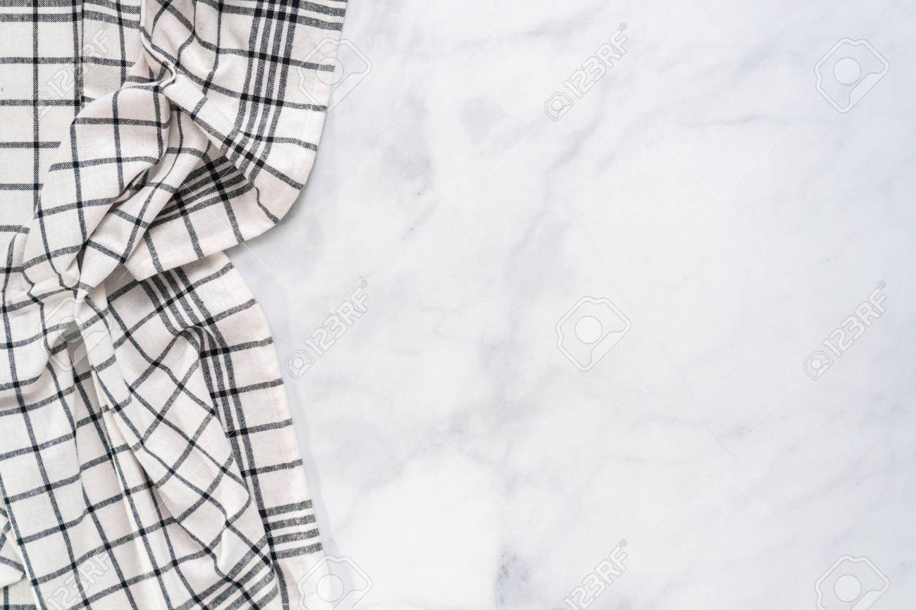 New kitchen towels with simple black pattern folded on marble counter. - 112178337 New kitchen towels with simple black pattern folded on marble counter. - 112178337