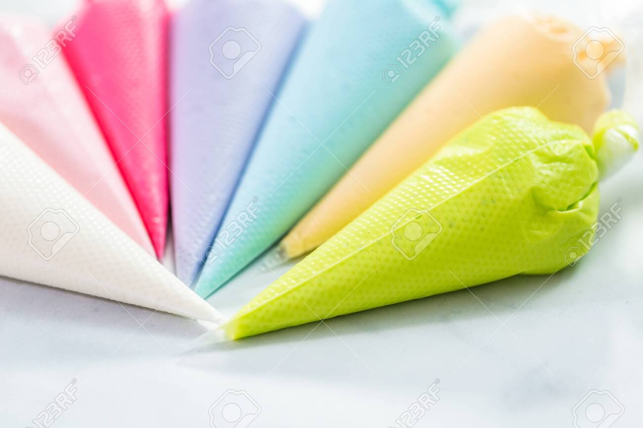 Piping Bags With Pastel Color Royal Icing To Decorate Easter Sugar Cookies Stock Photo Picture And Royalty Free Image Image 126952617