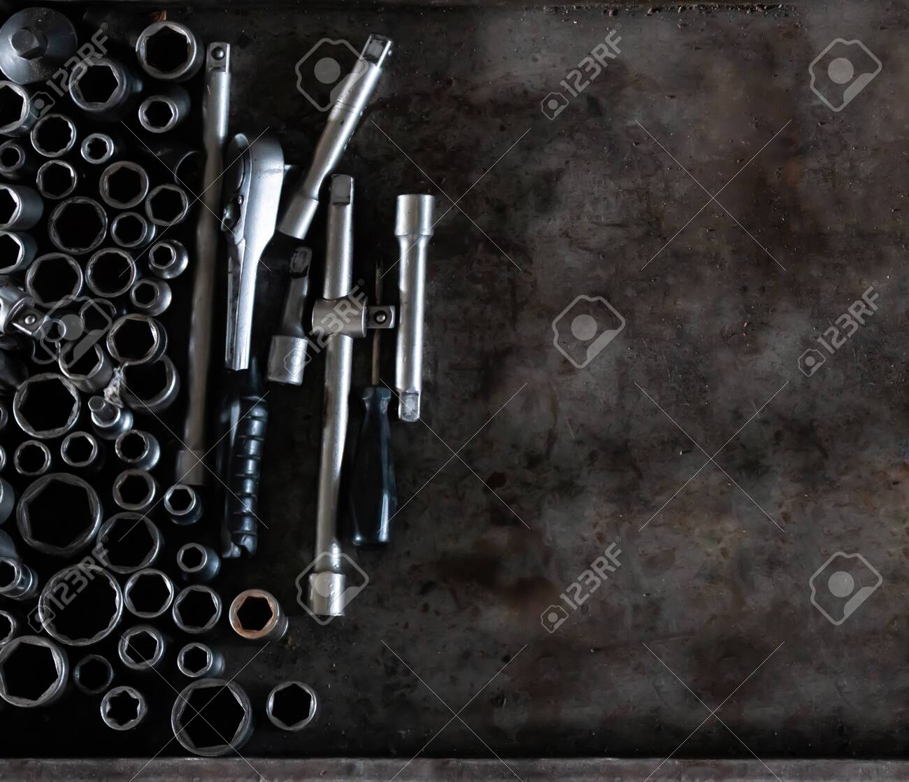 Mechanic tools set on metal background. Vintage style image of blank space on metal, lot of old tools. Copy space. Car service and repair concept. Tools on working table. - 139026700 Mechanic tools set on metal background. Vintage style image of blank space on metal, lot of old tools. Copy space. Car service and repair concept. Tools on working table. - 139026700