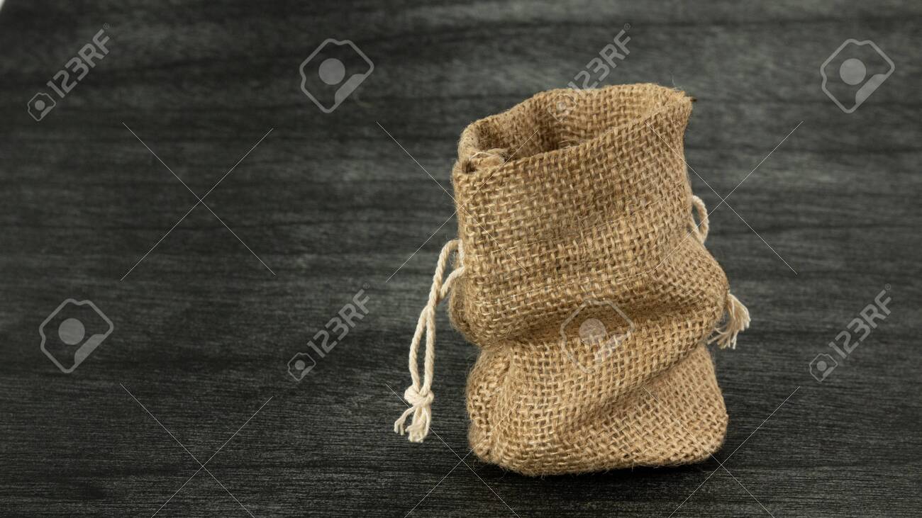 Burlap sack on dark background. Jute Empty Sack mock up. Copy space for text. Traditional Vintage Sack mock up. Linen sack copy space for product. - 145516855 Burlap sack on dark background. Jute Empty Sack mock up. Copy space for text. Traditional Vintage Sack mock up. Linen sack copy space for product. - 145516855