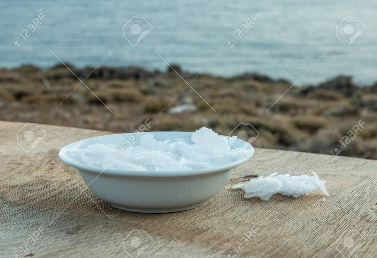 Flower of Greek sea salt crystals, south Crete. Natural traditional Fleur de sel from Crete. Sea salt flakes on wooden bakcground. - 152914394 Flower of Greek sea salt crystals, south Crete. Natural traditional Fleur de sel from Crete. Sea salt flakes on wooden bakcground. - 152914394