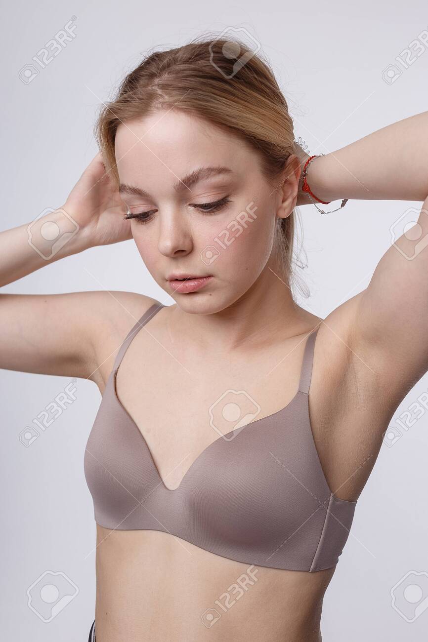 Pretty Caucasian Girl With Naked Shoulders Posing In Bra. Candid Studio  Portrait Stock Photo, Picture and Royalty Free Image. Image 147984173.