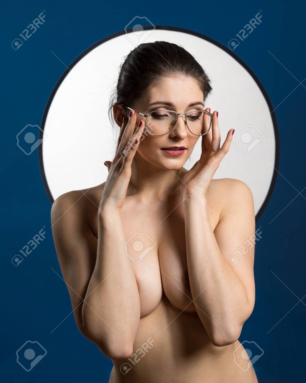Young Nude Woman With Make Up. Model With Glasses. Naked Girl Beauty  Portrait On Blue Background. Stock Photo, Picture and Royalty Free Image.  Image 114679434.
