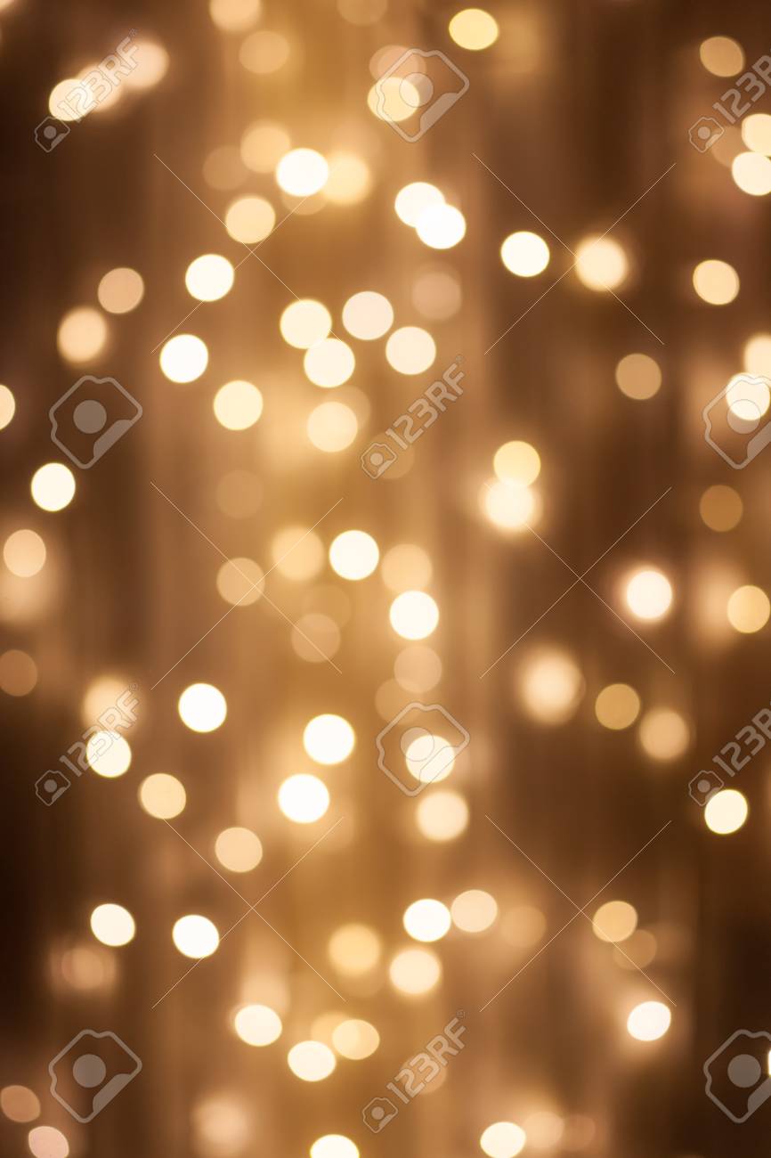 Christmas abstract background, beautiful christmas tree golden lights  hearts bokeh. blur of yellow glowing illumination in festive room. decor  for winter holidays. atmospheric moment photo – Background Image on Unsplash, image size:866x1300