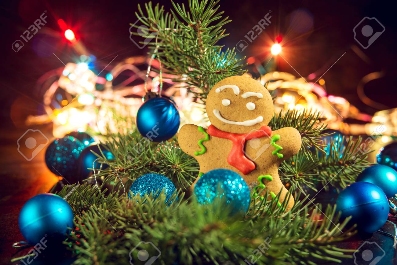 gingerbread man near christmas tree with toys by garland the concept of christmas stock photo - Christmas Tree With Garland gingerbread man near christmas tree with toys by garland the concept of christmas stock photo - Christmas Tree With Garland