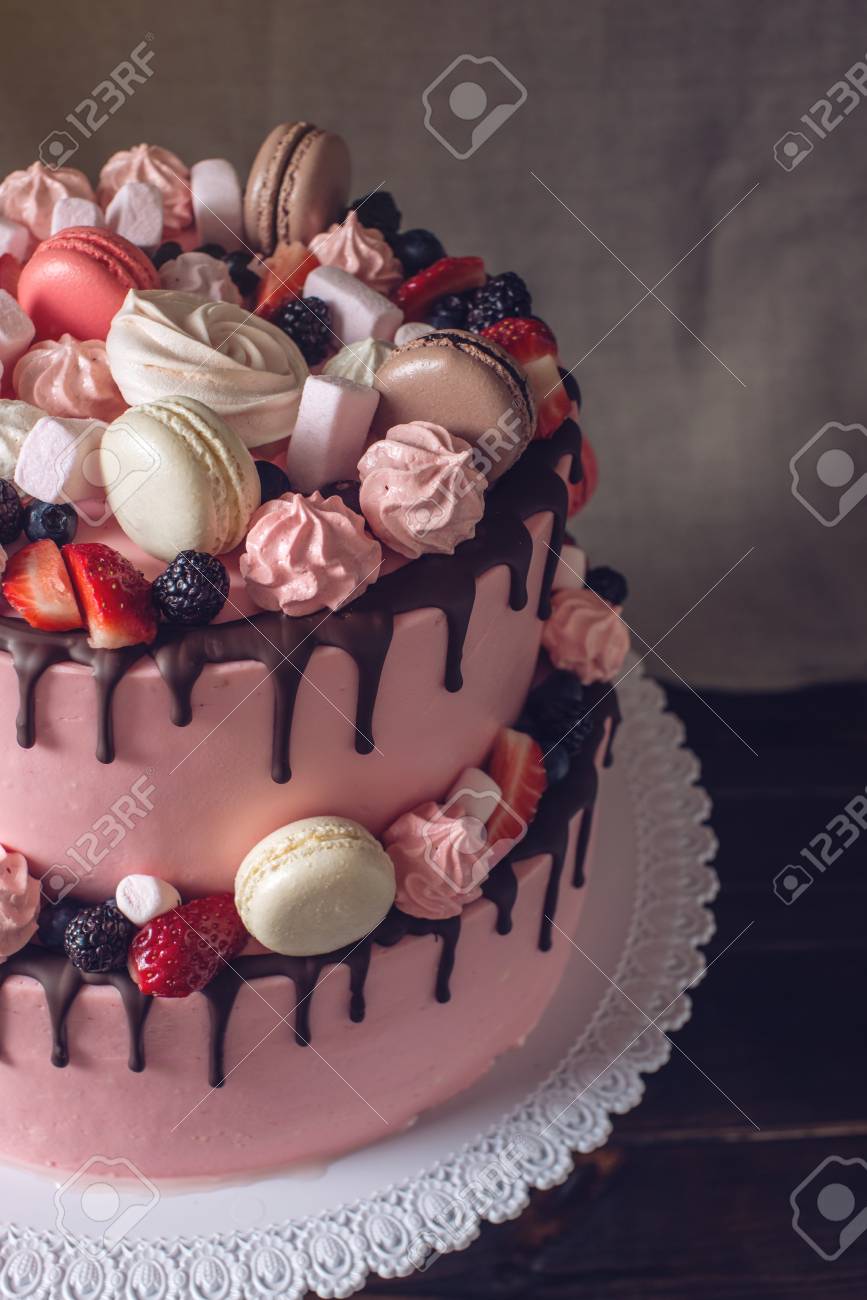 Pink 2 Tiered Cake Rustic Drizzled With Chocolate Berries Strawberries Blackberries Marshmallows And Macaroons On Top Beautiful Festive Kids Dessert Stock Photo Picture And Royalty Free Image Image