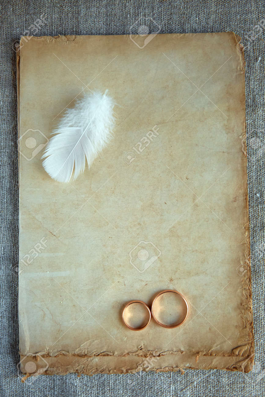 The wedding rings are on old vintage paper. Love letter. The concept of eternal love. - 158596246 The wedding rings are on old vintage paper. Love letter. The concept of eternal love. - 158596246