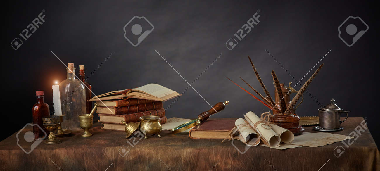 The workplace of a scientist or writer from past centuries. Vintage items, books and manuscripts on a dark background. Space for your text - 158618876 The workplace of a scientist or writer from past centuries. Vintage items, books and manuscripts on a dark background. Space for your text - 158618876
