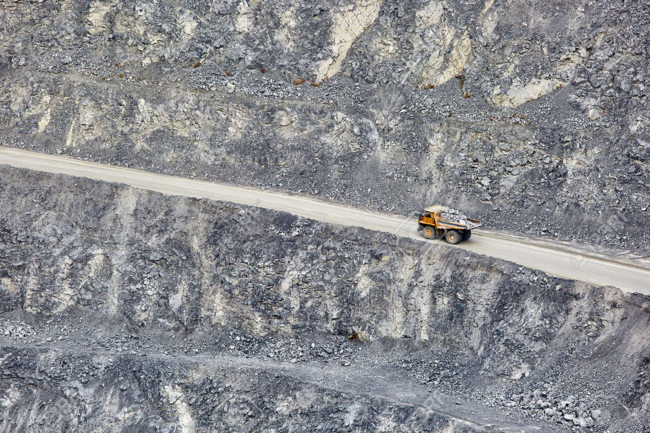 Top view of working BelAZ dump trucks in a stone and crushed stone quarry in Russia, Chelyabinsk region, Miass city. - 158618973 Top view of working BelAZ dump trucks in a stone and crushed stone quarry in Russia, Chelyabinsk region, Miass city. - 158618973