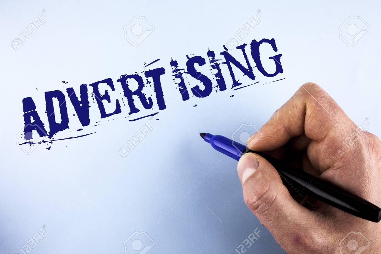 Handwriting Text Advertising Concept Meaning Reach Out World Branding With Digital Marketing Optimization Written By Man Plain Background Holding Marker In Hand Stock Photo Picture And Royalty Free Image Image 99821770