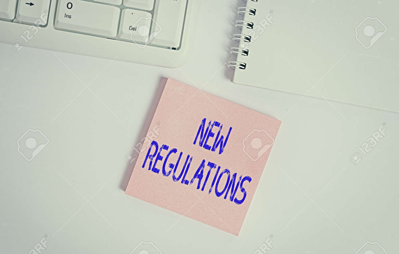 Word writing text New Regulations. Business photo showcasing Regulation controlling the activity usually used by rules. Empty note paper on the white background by the pc keyboard with copy space - 146934978 Word writing text New Regulations. Business photo showcasing Regulation controlling the activity usually used by rules. Empty note paper on the white background by the pc keyboard with copy space - 146934978