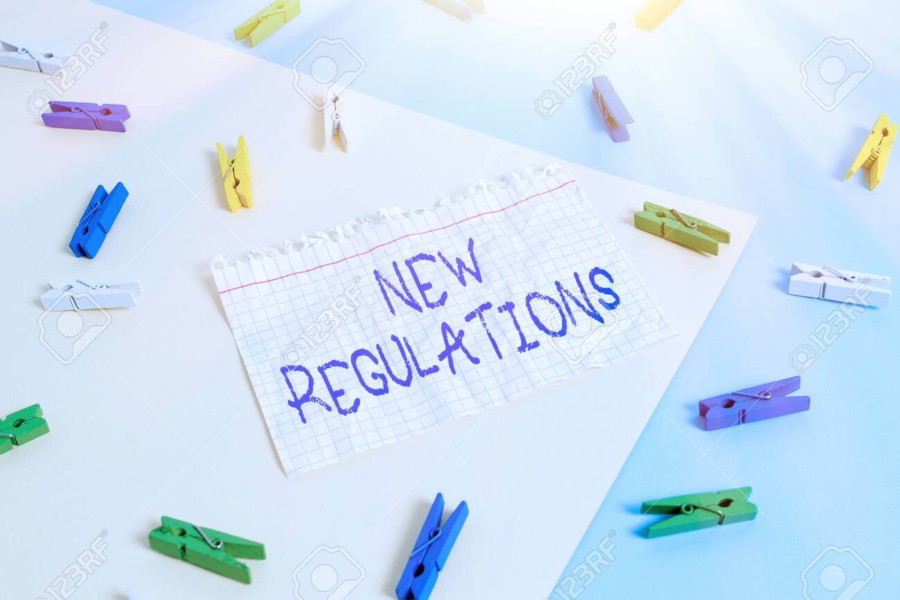 Word writing text New Regulations. Business photo showcasing Regulation controlling the activity usually used by rules. Colored clothespin paper empty reminder yellow blue floor background office - 146076549 Word writing text New Regulations. Business photo showcasing Regulation controlling the activity usually used by rules. Colored clothespin paper empty reminder yellow blue floor background office - 146076549