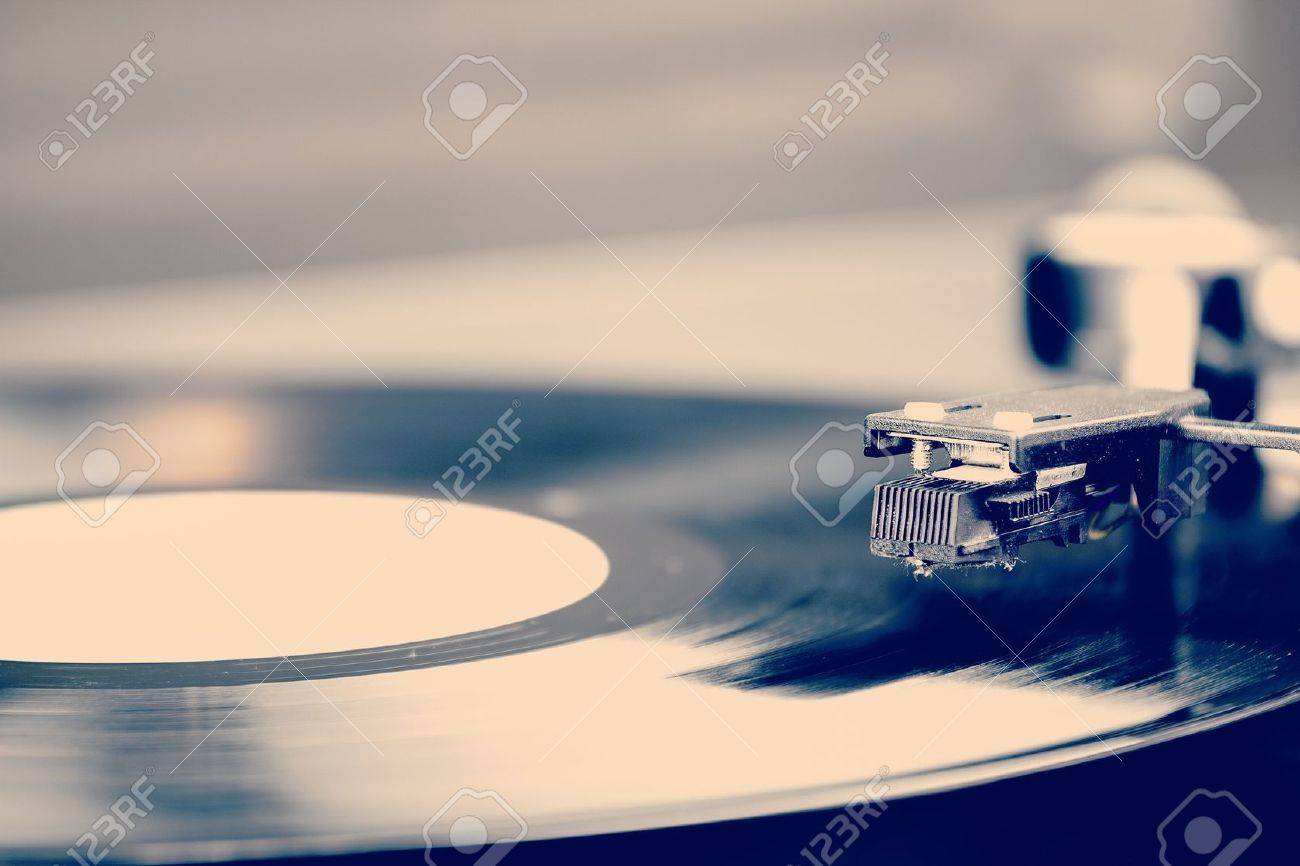 Spinning vinyl record. Motion blur image. Vintage toned. Shallow depth of field. - 16719954 Spinning vinyl record. Motion blur image. Vintage toned. Shallow depth of field. - 16719954