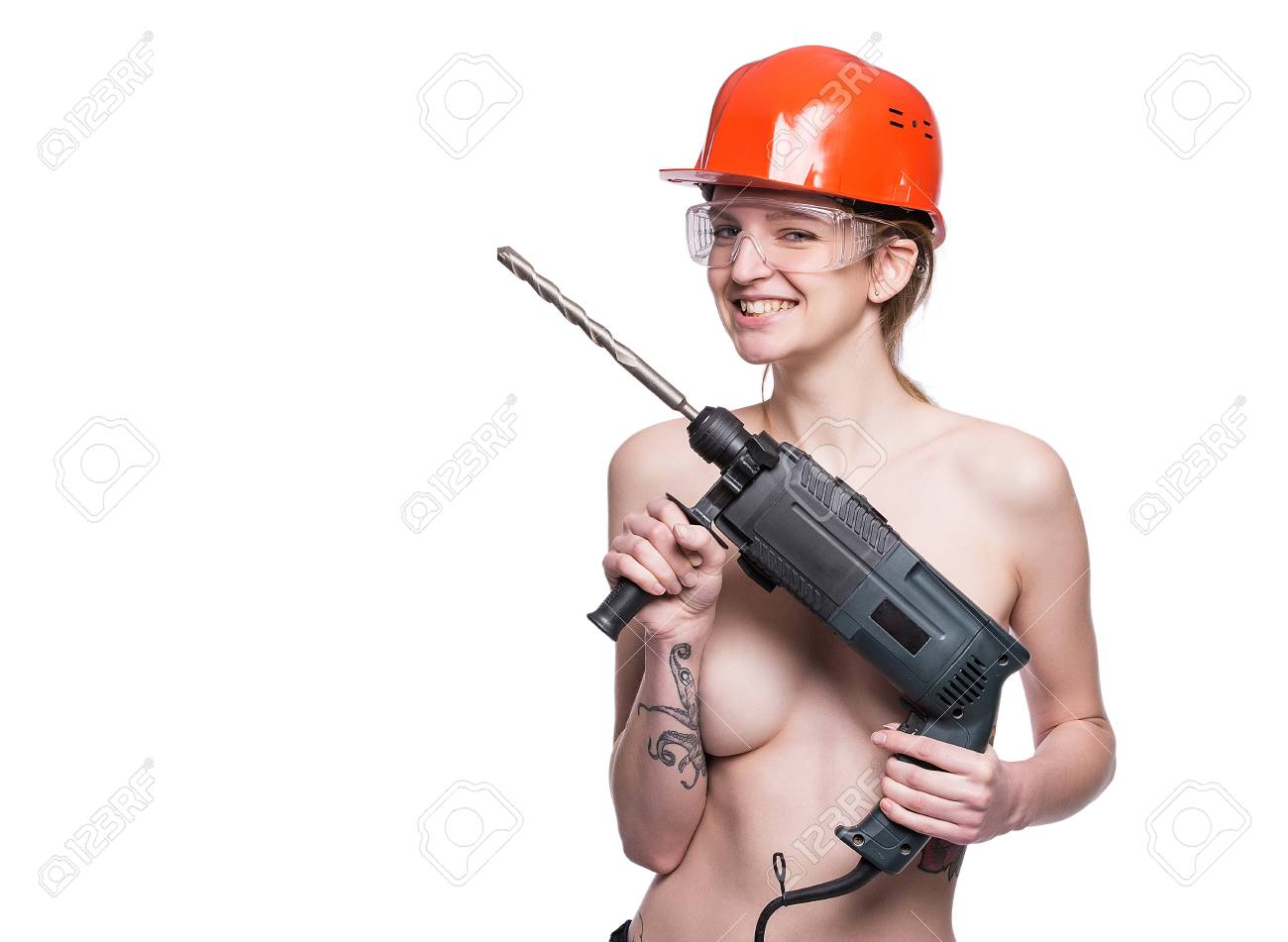 Young Sexy Nude Woman Holding A Construction Drill. Seductive Female  Builder Worker In Hard Hat And Construction Glasses. Isolated On White  Background. Copy Space Stock Photo, Picture and Royalty Free Image. Image